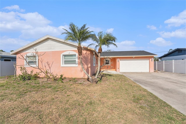 single story home with a garage and a front lawn