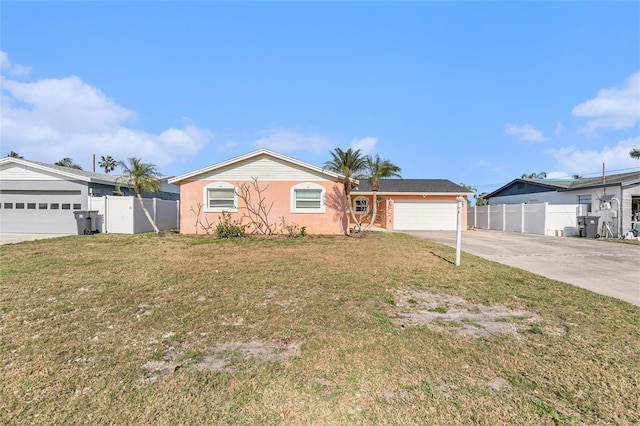 ranch-style home with a front lawn and a garage