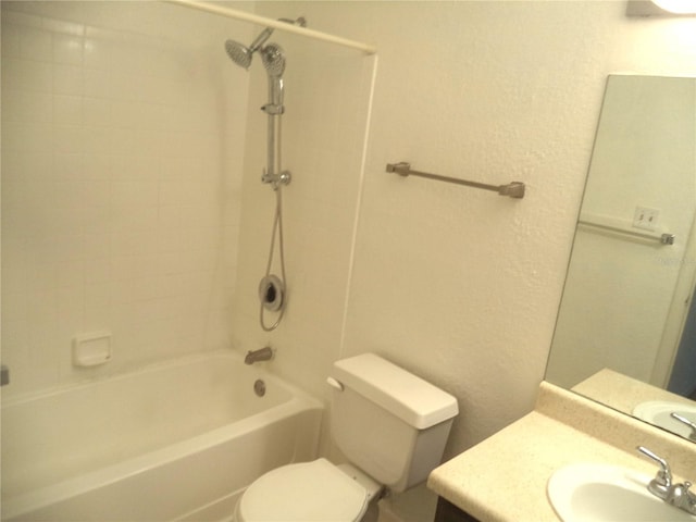 full bathroom with vanity, toilet, and washtub / shower combination