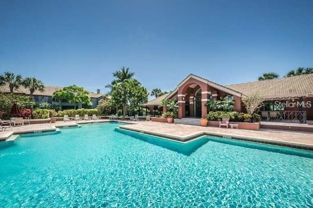 view of swimming pool with a patio