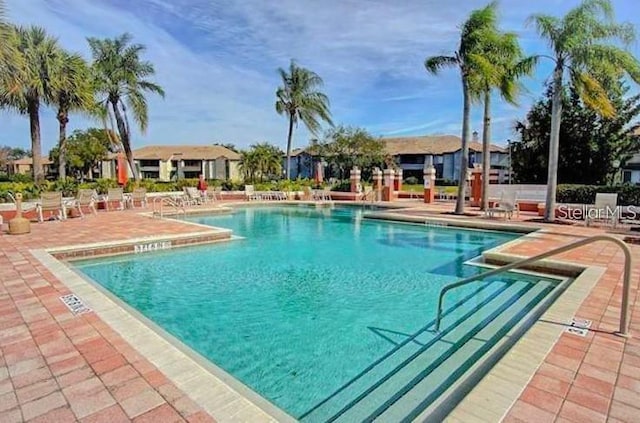 view of swimming pool with a patio