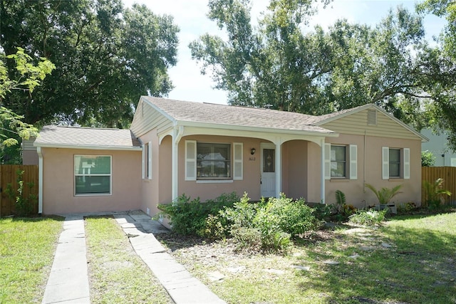 ranch-style home with a front yard