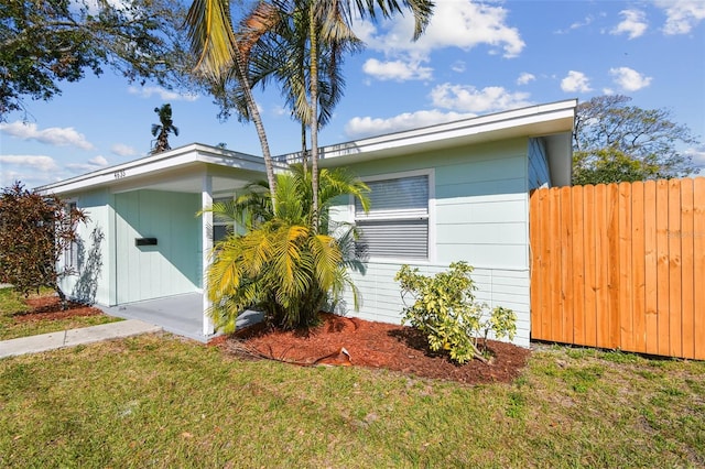 view of home's exterior featuring a yard