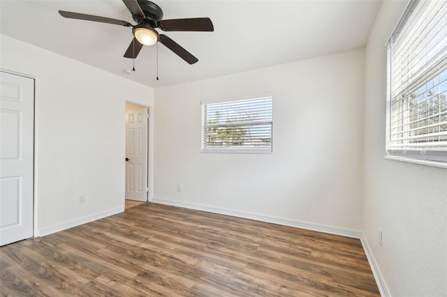 spare room with dark hardwood / wood-style floors