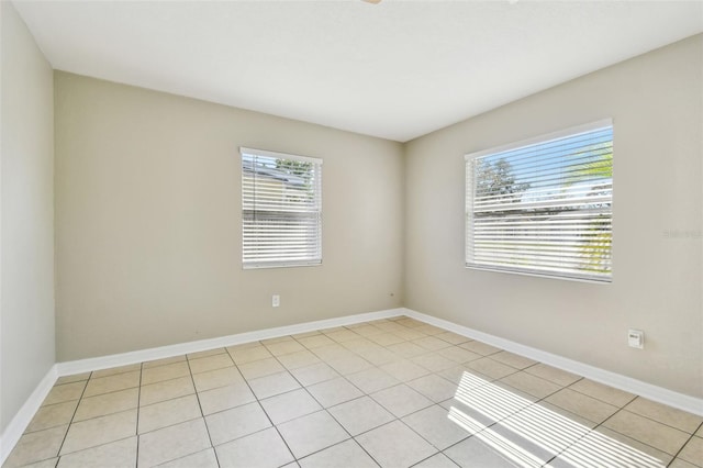 empty room featuring light tile patterned floors