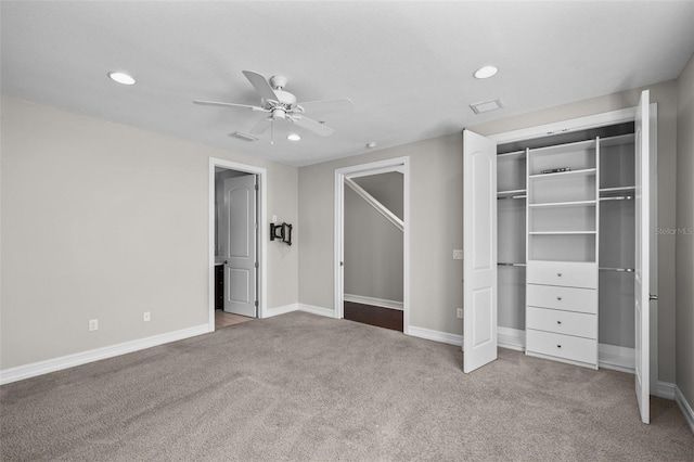 unfurnished bedroom featuring light colored carpet, ceiling fan, and a closet