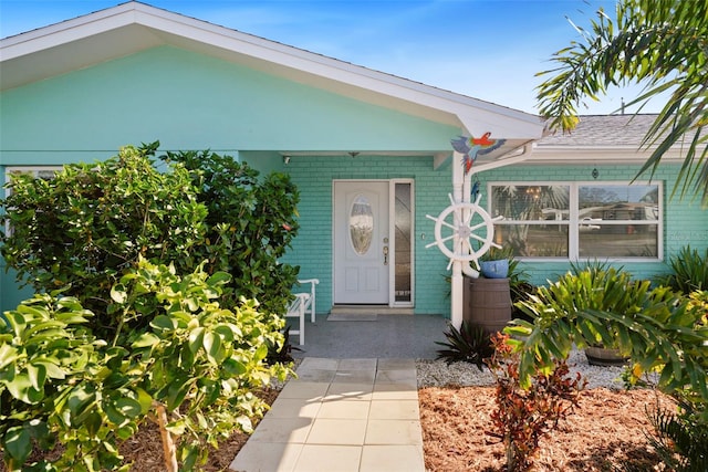 9911 Antilles Dr, Seminole, FL 33776 - doorway to property with brick siding