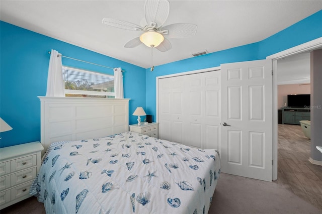 9911 Antilles Dr, Seminole, FL 33776 - bedroom featuring a ceiling fan, light colored carpet, a closet, and visible vents