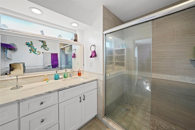 9911 Antilles Dr, Seminole, FL 33776 - full bath with a stall shower, vanity, and recessed lighting