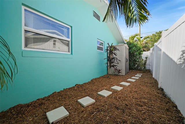 9911 Antilles Dr, Seminole, FL 33776 - view of yard featuring a fenced backyard and visible vents