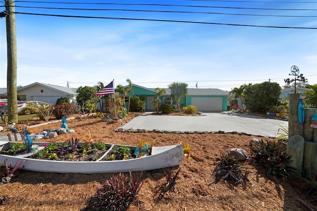 9911 Antilles Dr, Seminole, FL 33776 - view of front facade featuring a garage and driveway