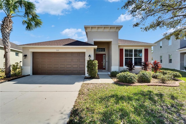 view of front of property with a garage and a front lawn