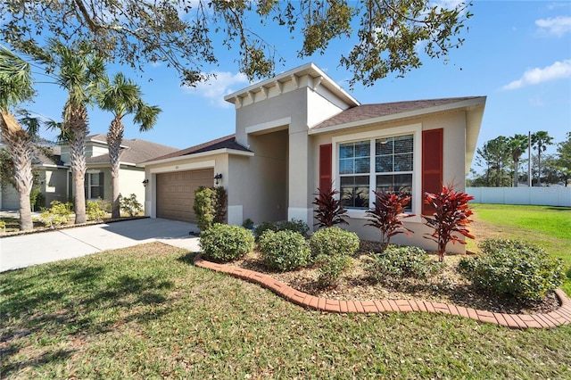 view of front of home featuring a front yard and a garage