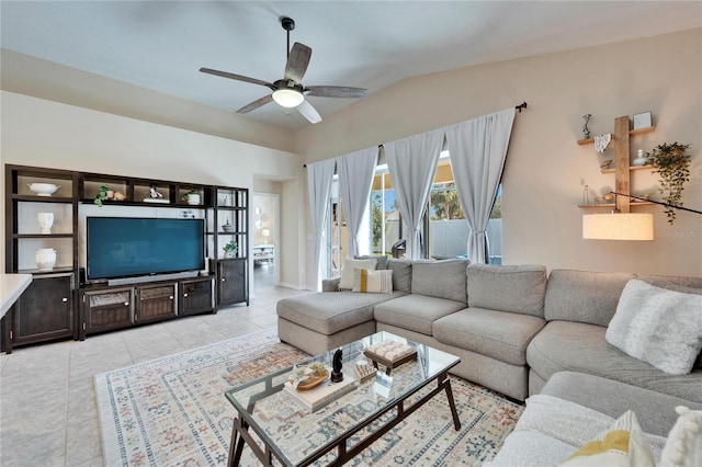 tiled living room featuring lofted ceiling and ceiling fan