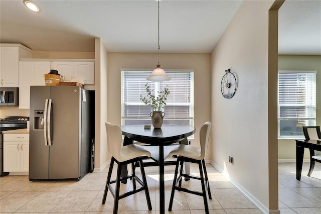 tiled dining space with plenty of natural light