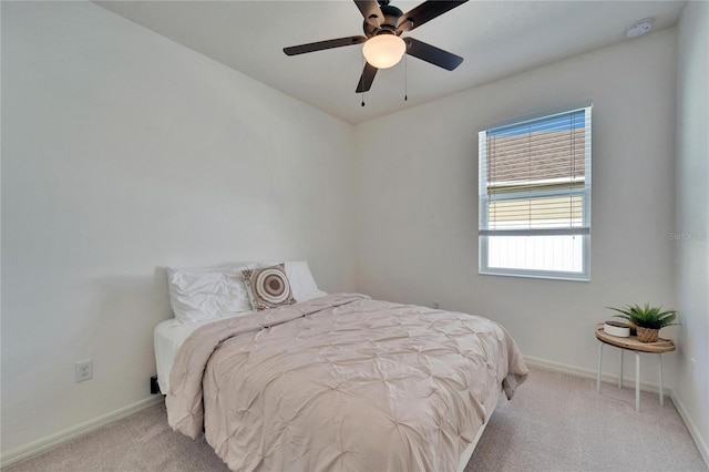 bedroom with light colored carpet and ceiling fan