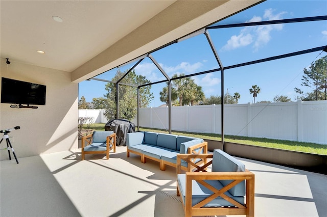 view of patio with an outdoor living space and a lanai