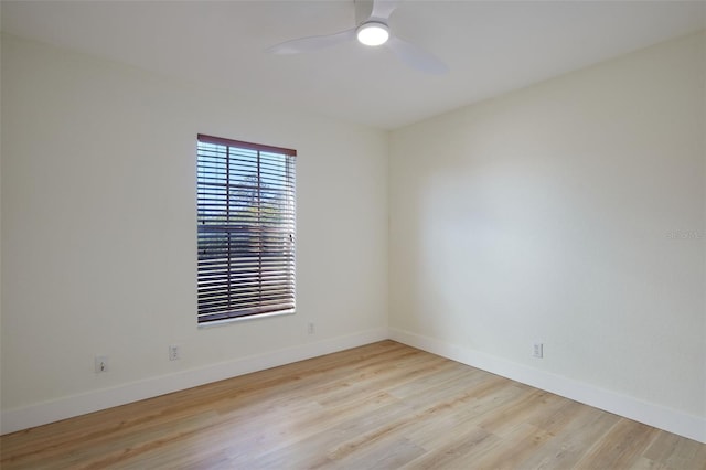 spare room featuring ceiling fan and light hardwood / wood-style flooring