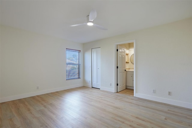 unfurnished bedroom featuring ceiling fan, connected bathroom, and light hardwood / wood-style floors