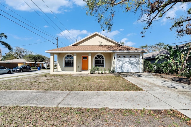 view of front of home featuring a garage, covered porch, and a front lawn