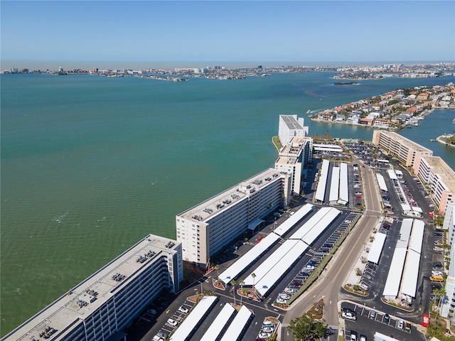 birds eye view of property with a water view and a city view