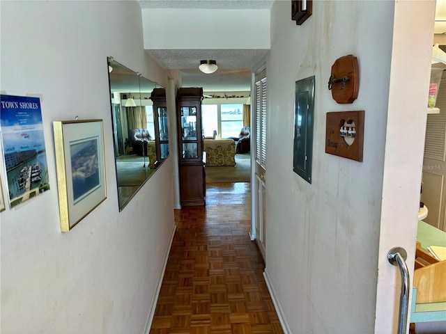 hallway featuring a textured ceiling