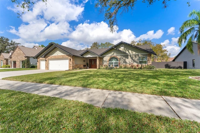 view of front of property with a garage and a front lawn