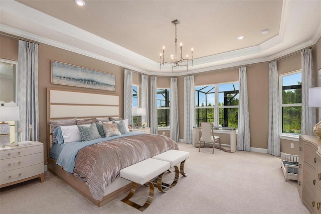 bedroom with crown molding, light colored carpet, a tray ceiling, and a notable chandelier