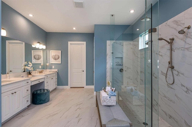 bathroom featuring vanity and a tile shower