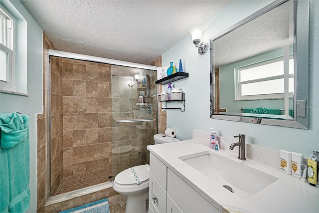 13614 Evelane Dr, Hudson, FL 34667 - full bath featuring toilet, a shower stall, a textured ceiling, and vanity