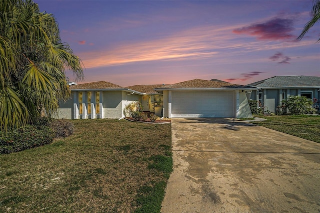13614 Evelane Dr, Hudson, FL 34667 - single story home featuring stucco siding, driveway, an attached garage, and a front lawn