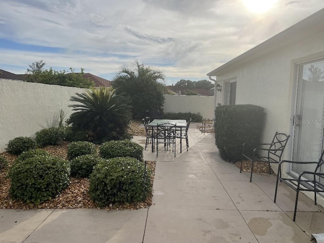 view of patio / terrace featuring a fenced backyard and outdoor dining area