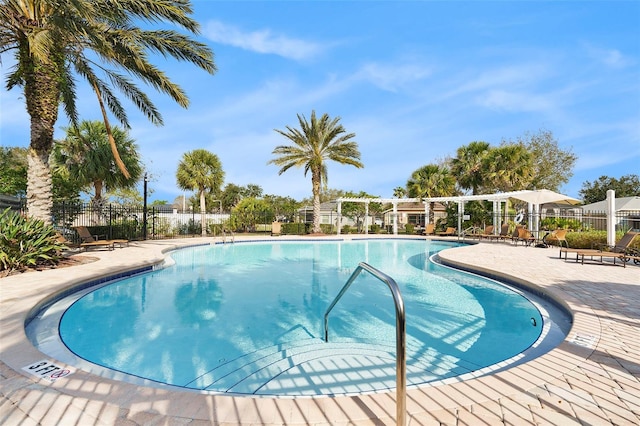 community pool featuring fence