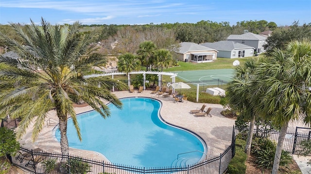 community pool featuring a gazebo, a patio area, and fence