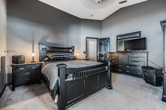 bedroom featuring light carpet and vaulted ceiling