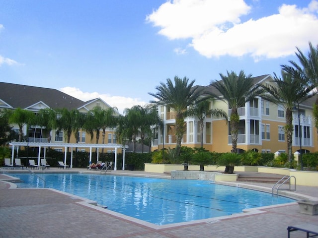 view of swimming pool with a patio