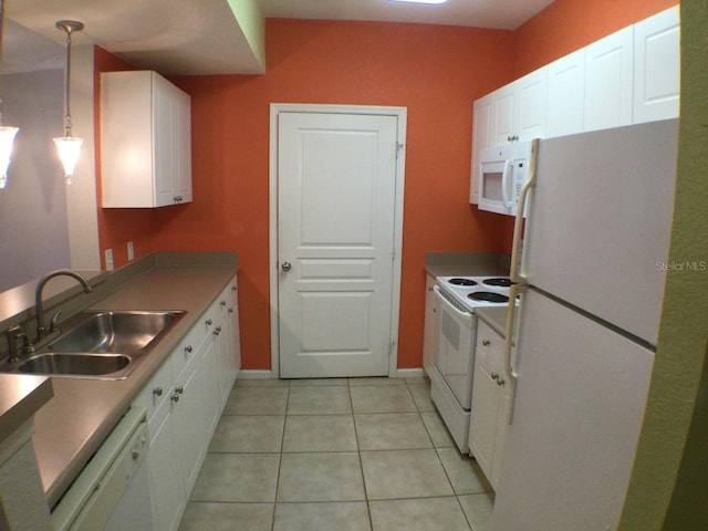 kitchen featuring pendant lighting, sink, white appliances, white cabinets, and light tile patterned flooring