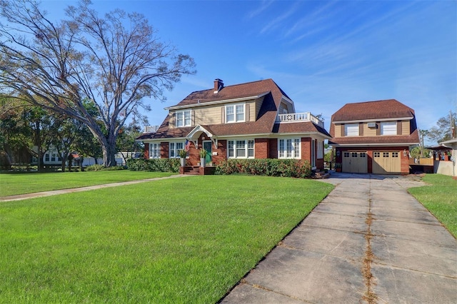 view of front of home with a garage, a front yard, an outdoor structure, and a chimney