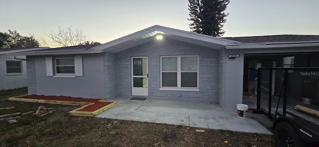 back of house with a patio