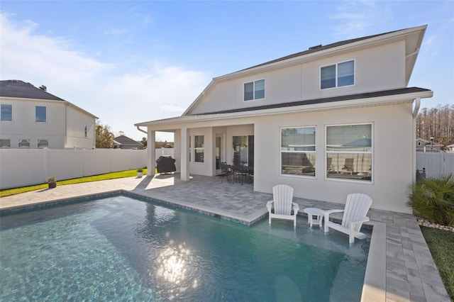 rear view of property with a patio