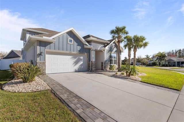 view of front of house with a garage and a front lawn