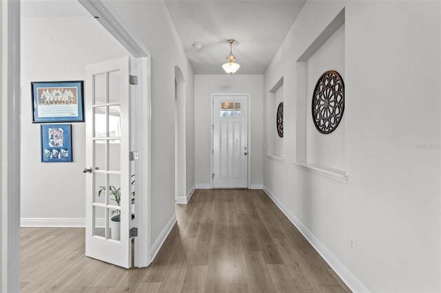 entryway with light hardwood / wood-style flooring