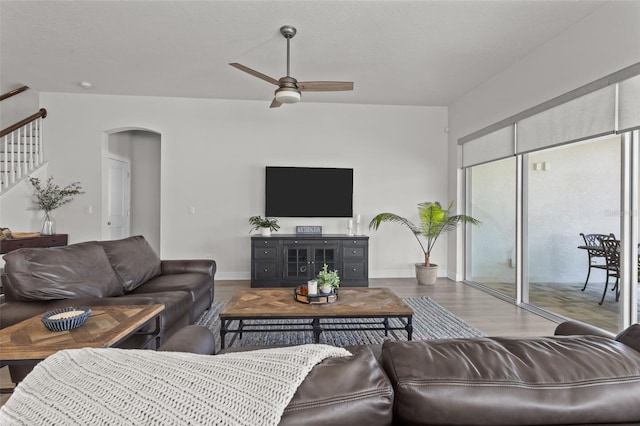 living room with ceiling fan and hardwood / wood-style floors