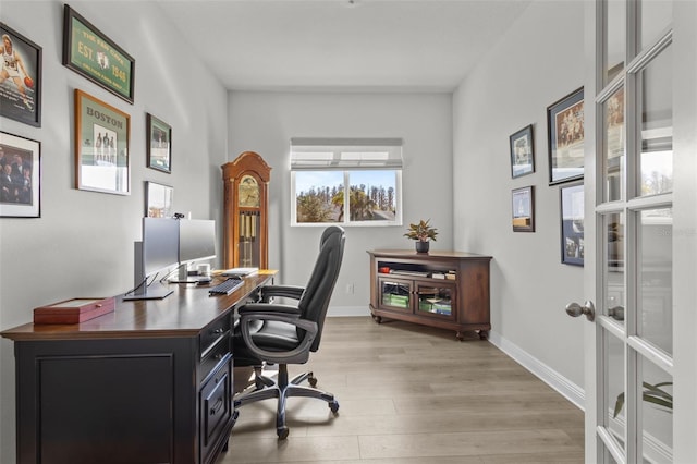 office area with light hardwood / wood-style flooring