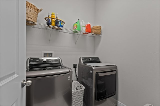 laundry room featuring washer and clothes dryer