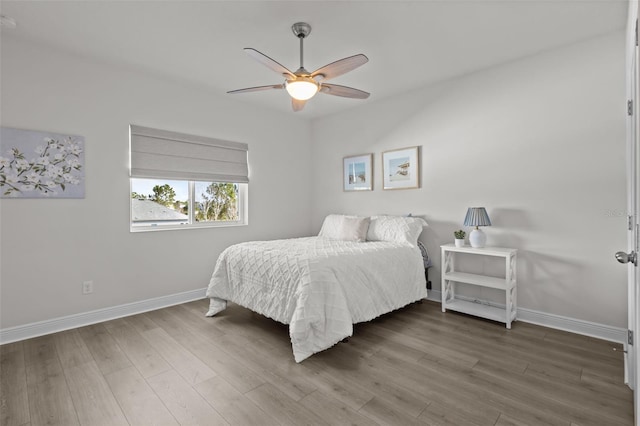 bedroom featuring wood-type flooring and ceiling fan