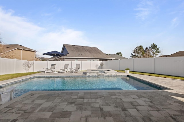 view of pool with an in ground hot tub and a patio area