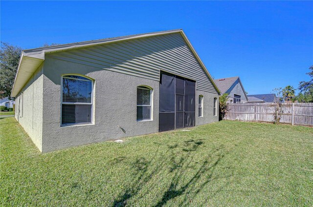 back of house featuring a yard