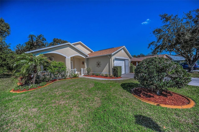 single story home with covered porch, a front lawn, an attached garage, and stucco siding