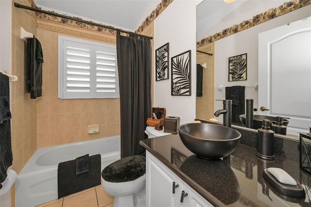 full bath with shower / tub combo, tile patterned flooring, vanity, and toilet